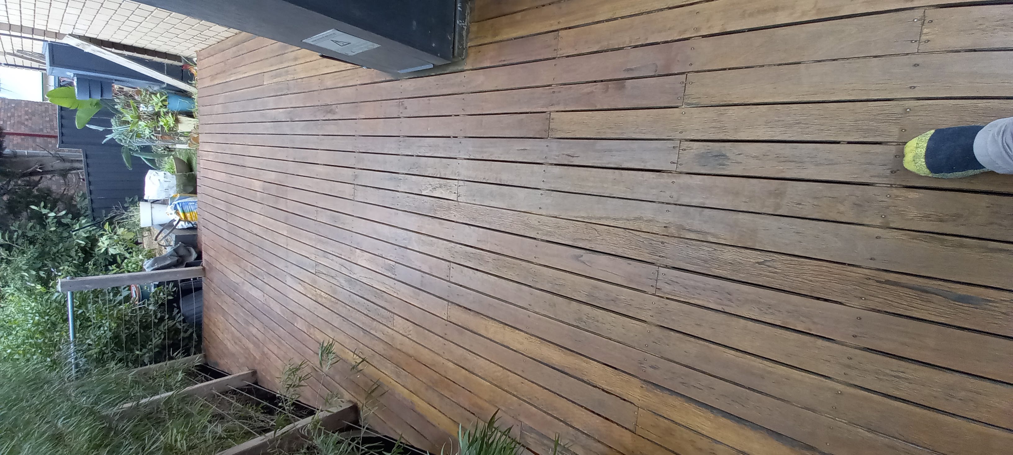 Timber deck boards after sanding and re-oiling, showing restored colour and grain
